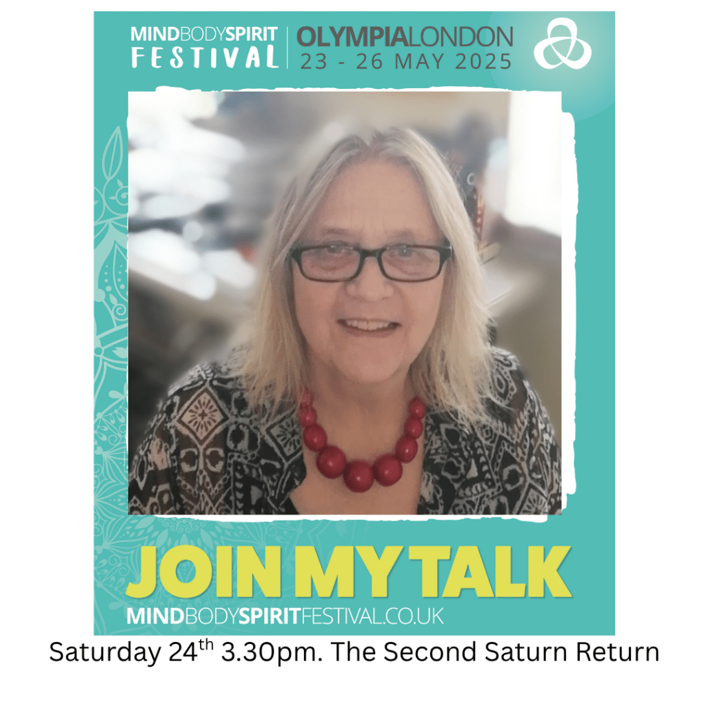 Promotional image for the Mind Body Spirit Festival featuring a smiling woman with glasses and a necklace, announcing her talk on 'The Second Saturn Return' scheduled for Saturday at 3:30 PM.